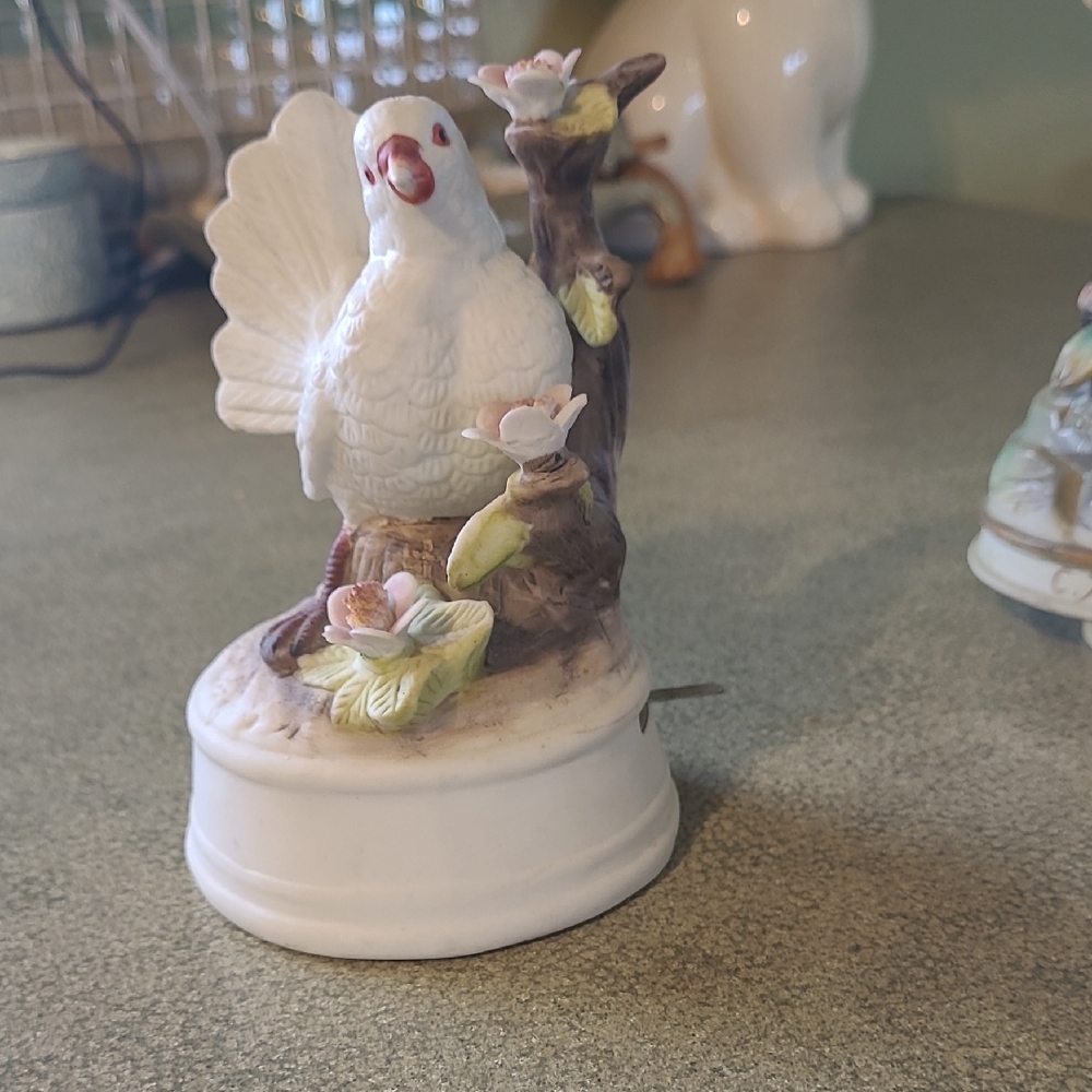 White Ceramic Bird Figurine with Floral Accents